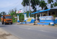 Truk tanah timbun melintas di Desa Bandar Labuhan, Minggu (12/1). 